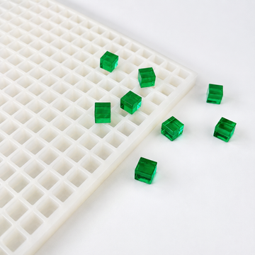 1mL cube gummy mold shown with translucent emerald green cube gummies