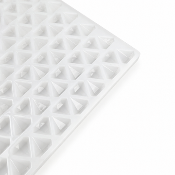 Close-up of an empty 2mL diamond gummy mold with 179 cavities on a white background