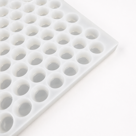 Close-up of an empty 3mL gumdrop gummy mold with 262 cavities on a white background