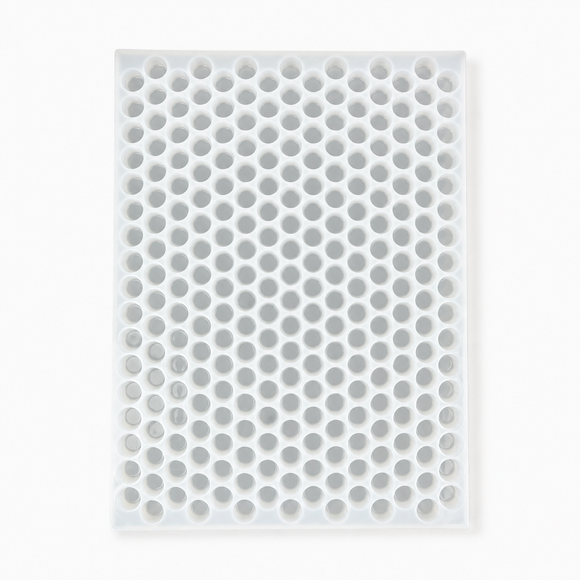 Full vertical top view of an empty 3mL gumdrop gummy mold with 262 cavities on a white background