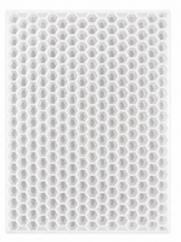 Top view of an empty 3mL hexagon gem gummy mold with 263 cavities on a white background
